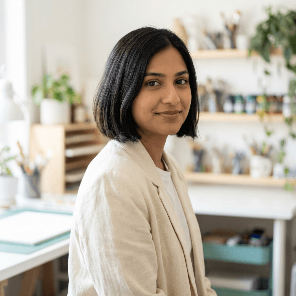 Priya Raman in business casual attire outside a sedan